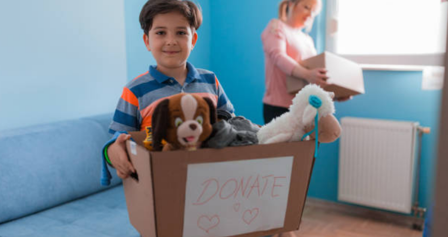 a kid donating his things