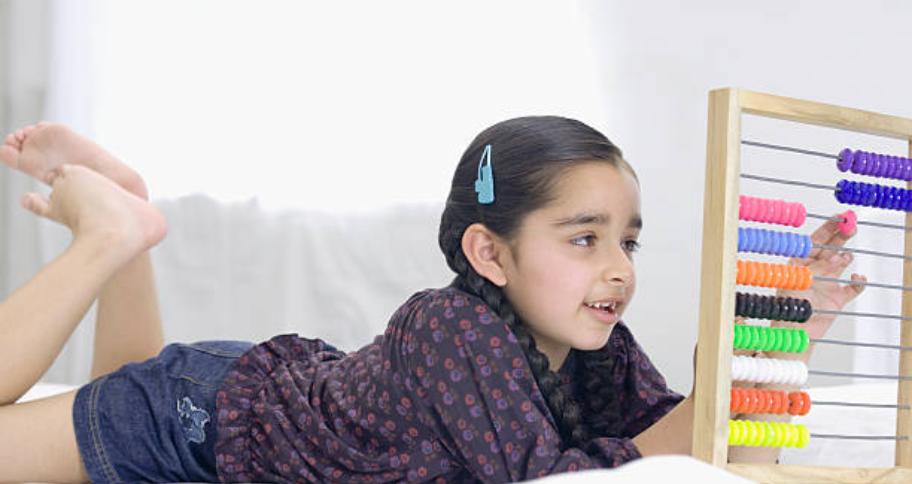 a girl playing with abacus