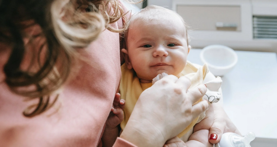 a mother spending time with a baby for Early childhood brain development