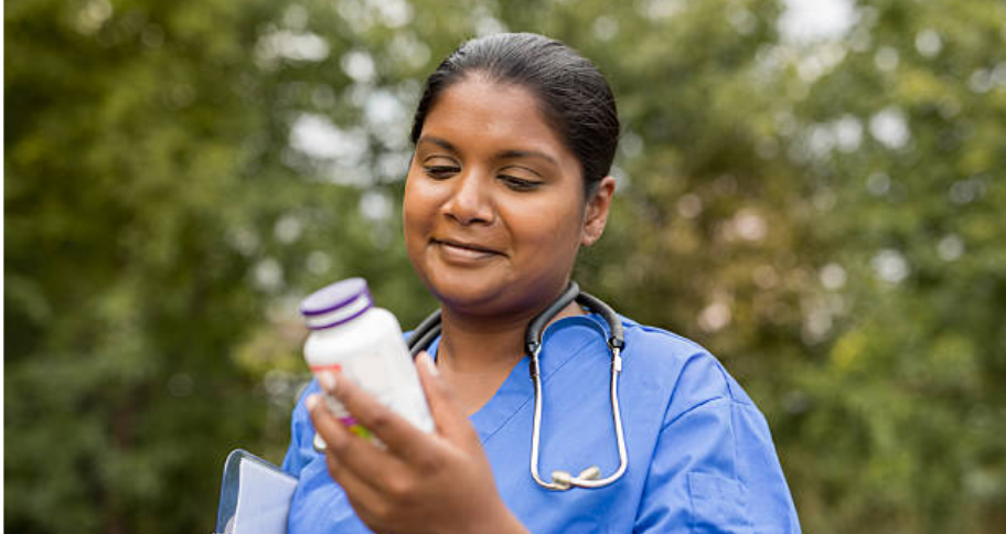 a nurse looking at medicine