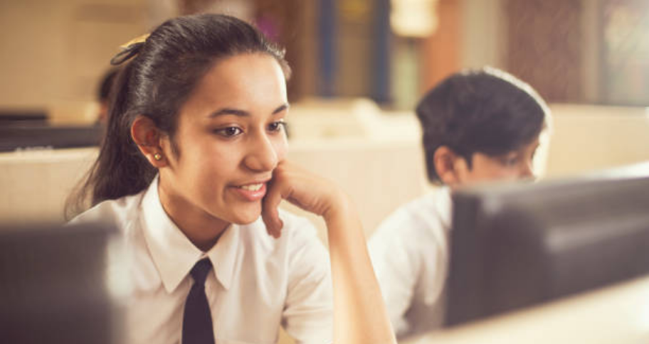 students sitting on computer