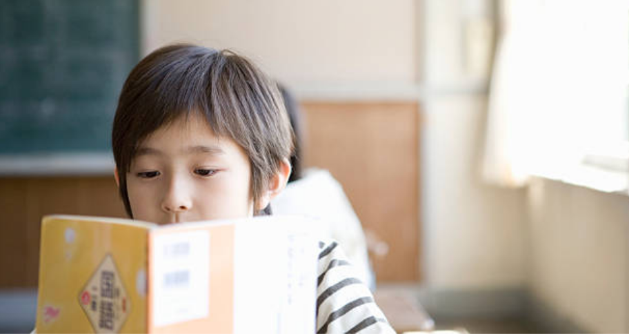 boy trying to learn a new language