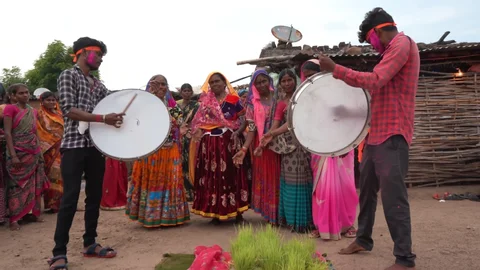 A close-up of a Lambadi dance performance with the focus on musical instruments like the dholak (drum) and nadaswaram (wind instrument), positioned prominently during the lively, rhythmic dance.