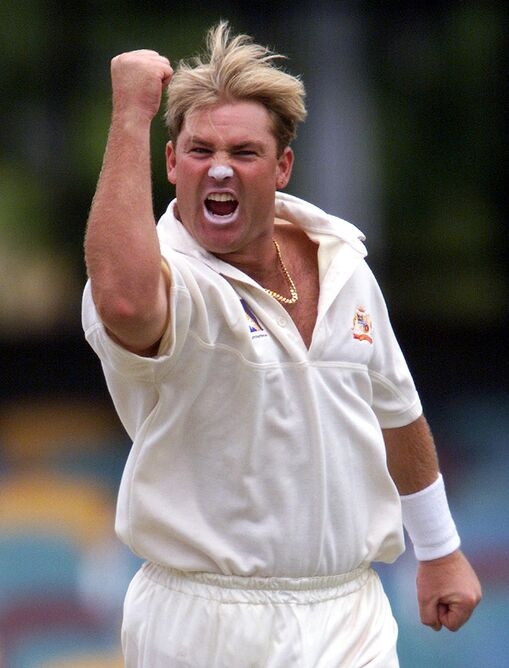 Shane Warne delivering a spin ball; the legendary leg-spinner who took over 700 Test wickets.