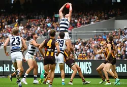 Two teams of 18 players each engaging an Australian Rules Football (AFL) match