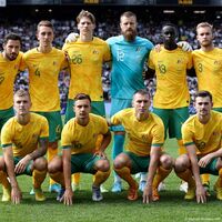 The Australian soccer team of 23 players posing in full jerseys celebrating their international representation and unity.