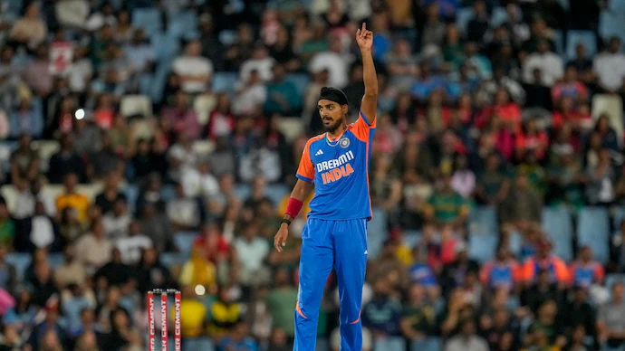 Arshdeep Singh, in India’s ODI jersey, bowling a sharp delivery with focus and intensity during a cricket match.