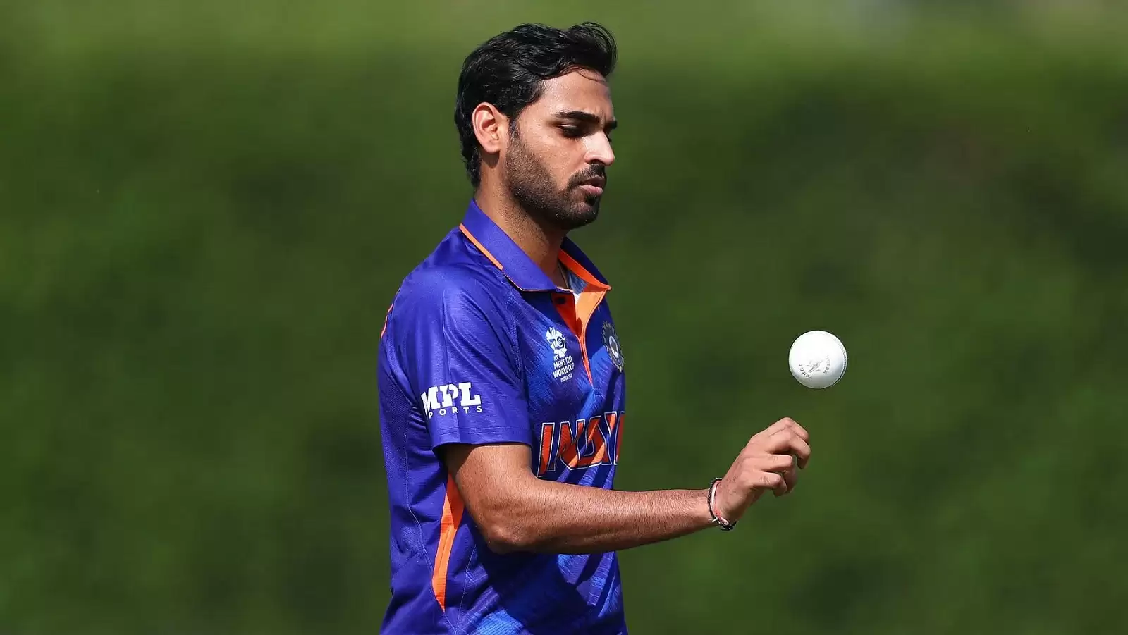 Bhuvneshwar Kumar, captured mid-action while bowling a swinging delivery in the Indian team’s ODI jersey.