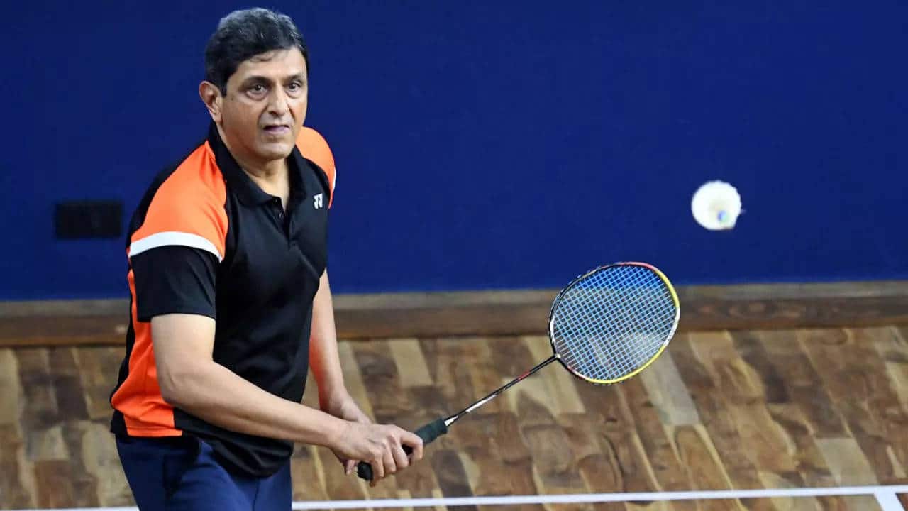 Prakash Padukone is in action on the court, epitomizing grace and skill as the first Indian to win the prestigious All England Championship in 1980.