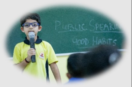 Indian primary school student practicing public speaking