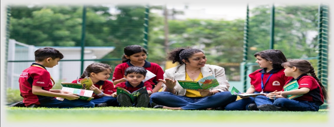 Teacher providing professional help to Indian primary school student