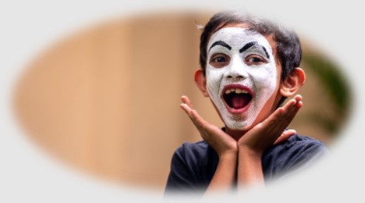 Primary school child in India acting in a school play