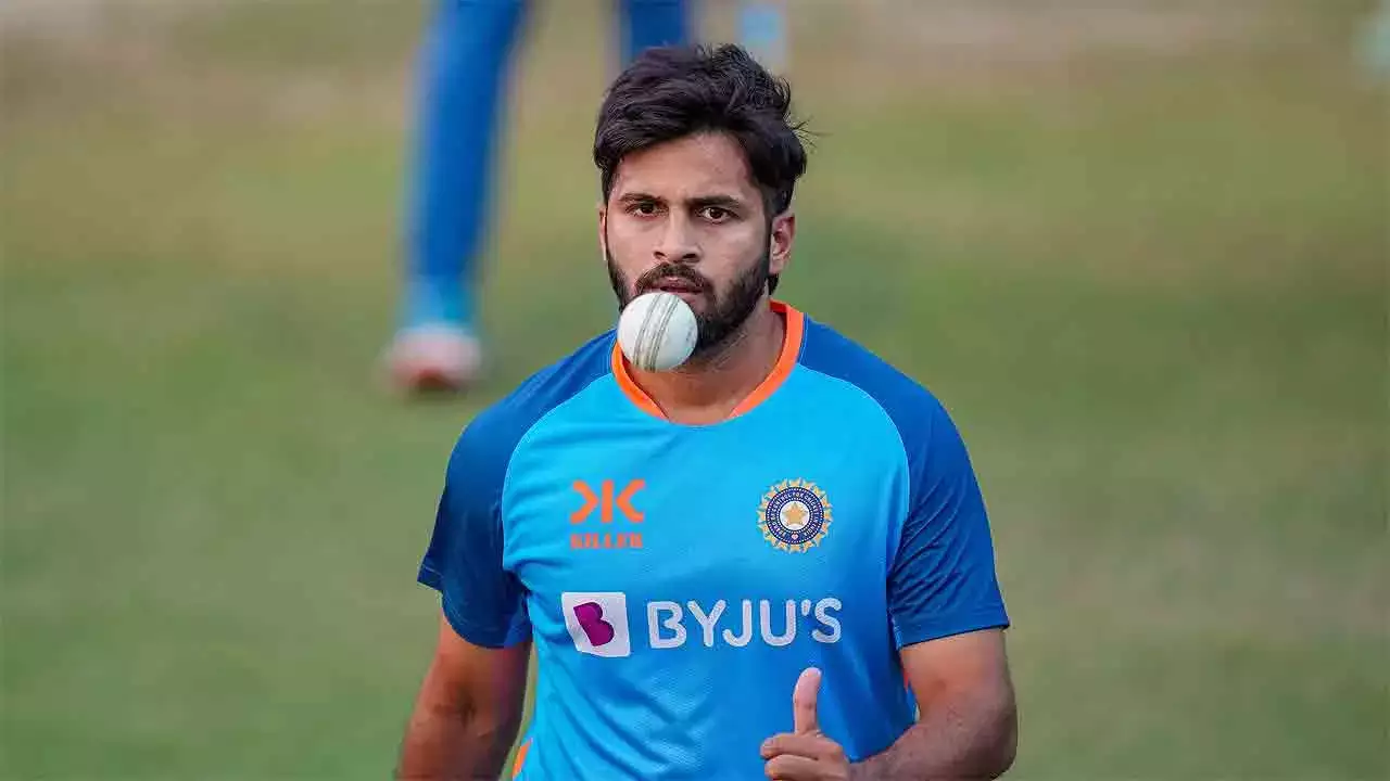 Shardul Thakur, in action on the cricket field, bowling with precision and focus in India’s blue jersey.