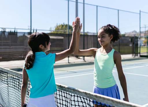 Two friends playing lawn tennis.