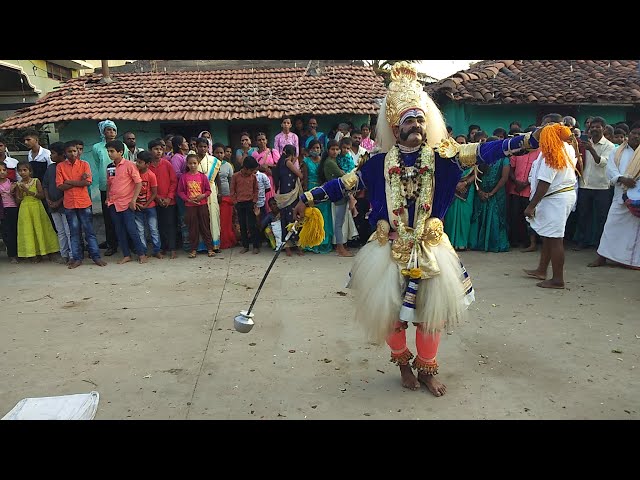 A traditional Veergase performance in a village setting, with performers dressed