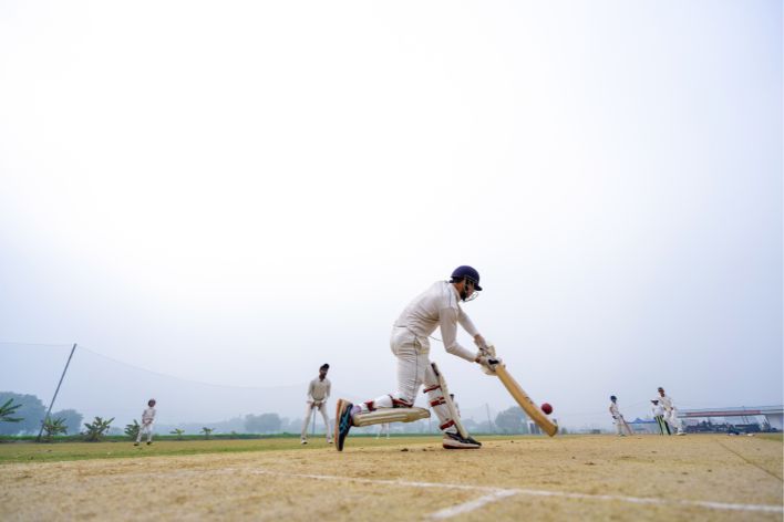 Boy Hitting Ball