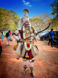 Traditional dress for Veergase performance, featuring vibrant attire with intricate designs