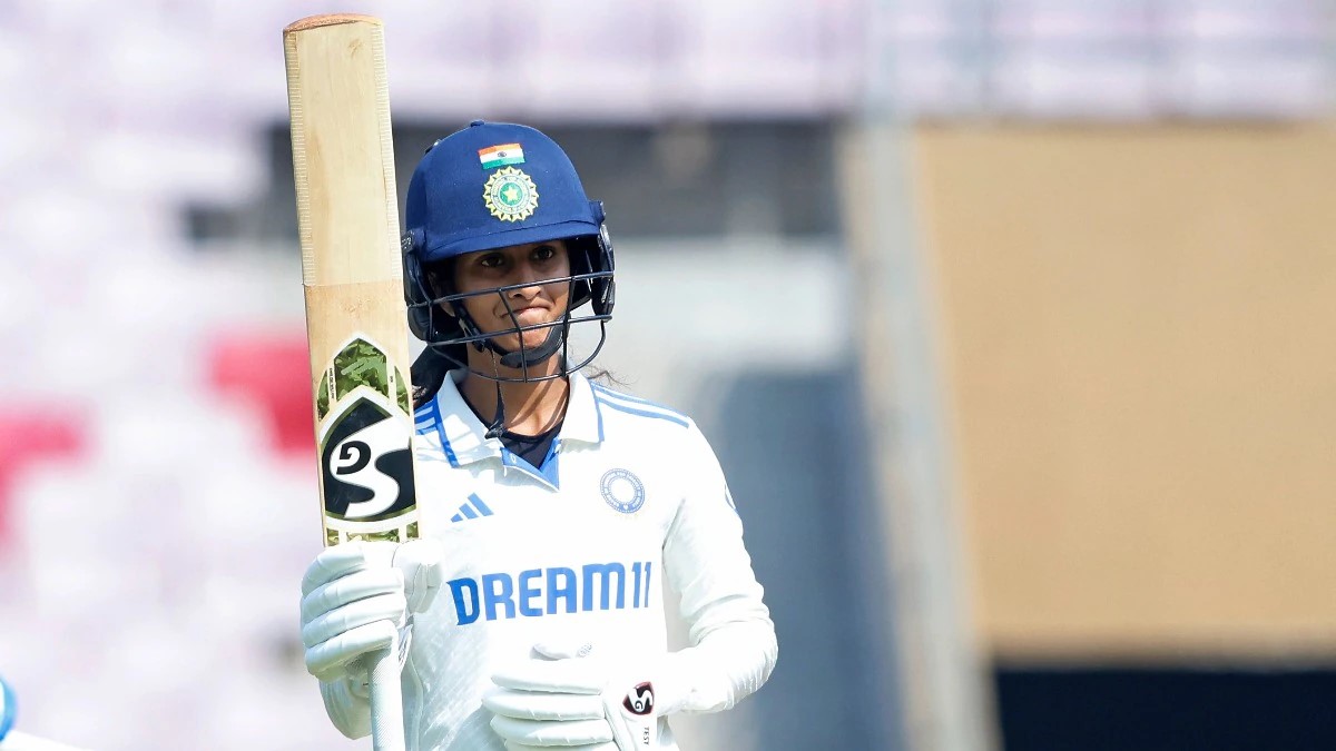 Jemimah Rodrigues raising her bat after scoring a fifty during her Test debut for India