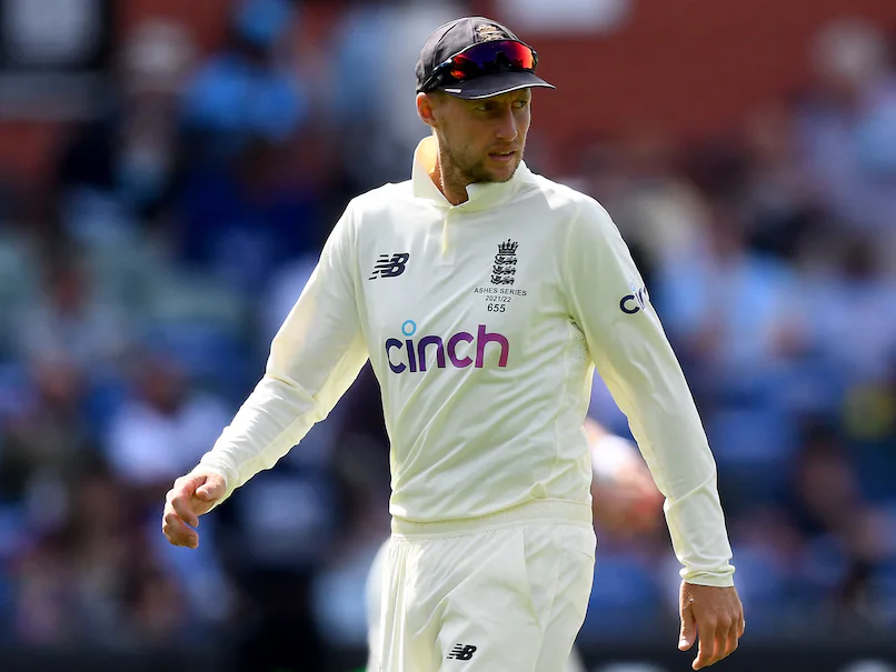 Joe Root raising his bat after scoring a Test hundred, reflecting his consistency and his record of over 10,000 Test runs