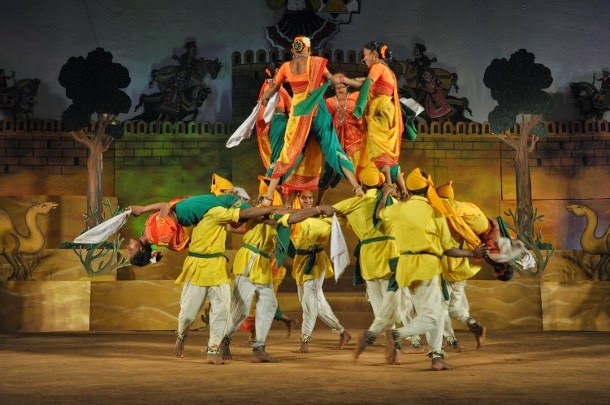 A Khyal folk theatre performance featuring actors in ornate.