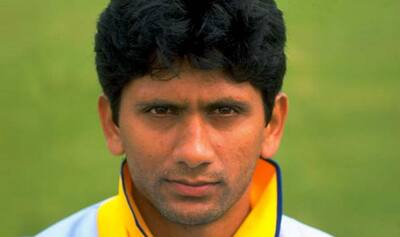 Venkatesh Prasad, wearing India's ODI jersey, delivering a ball with a focused expression during a match.